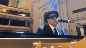 Johnny Britt performing at the piano