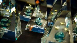 Large Pyramid Award Statues for a Film Festival that include Yellow Stars and a Globe Earth. The award statue in Focus is: Life the Greatest Story.