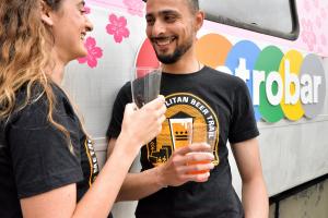 this is a photo of people wearing Metropolitan Beer Trail t-shirts