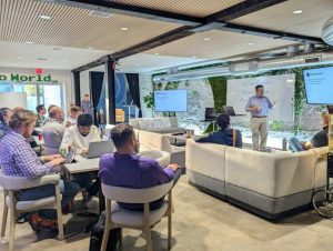 AI engineer Brian Collard presenting at an AI Tinkerers event