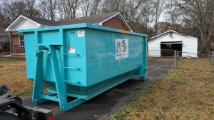 Trash Pandy teal 20 yard roll-off dumpster delivered to residential driveway in Smyrna TN