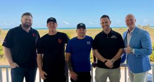 Five members of the BuilderLync executive team, including CEO, Brad Strawbridge posing together outdoors during an EOS Clarity Break