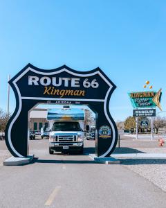 Cruise America RV in Kingman, AZ, under a big Route 66 sign in the road.