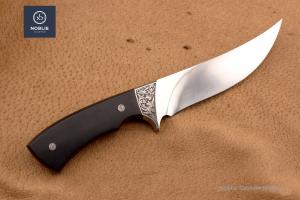 Noblie custom deer skinner hunting knife with black handle on leather background