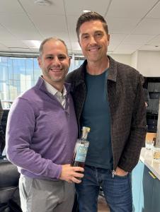 Palm Republic Co-Founder and Actor, Eric Winter, from The Rookie, with Alpha Funds Founder and Astronaut, J.D. Russell holding Palm Republic's Premium Aged Rum