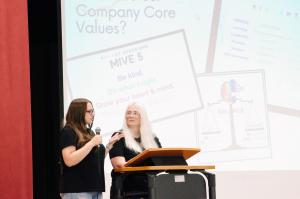 Katelyn Reisma and Michelle Read of Vibrant Occasions Catering present the company's core values and heart leadership framework to students at Glen Rose High School.
