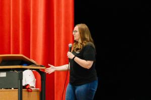 Leah Seale, Director of Community and Vendor Relations at Vibrant Occasions Catering, speaks to students at Glen Rose High School during the company's heart leadership presentation.