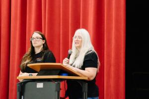 Katelyn Reisma and Michelle Read of Vibrant Occasions Catering address students at Glen Rose High School during the company's heart leadership presentation.