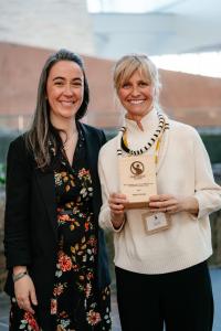 Roxanne Joyal of &BACK COFFEE and Julie Francoeur, CEO of Fairtrade Canada, holding the 2026 Canadian Fair Trade Award for Producer Impact and Leadership in Winnipeg.