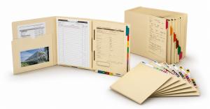 Open custom file folder with forms and pockets beside indexed folders and tabbed dividers on a white background.