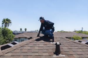 McAllen Valley Roofing Co. certified inspector looking for roof damage on a completed residential roof.