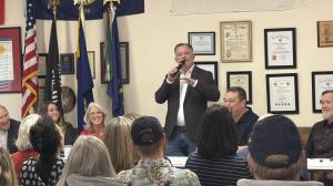 Mark Fitzpatrick speaking at a Bonner County Republican Women dinner event in Idaho, addressing attendees during a campaign stop