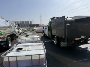 Large storage tanks holding used cooking oil at a recycling facility in Los Angeles