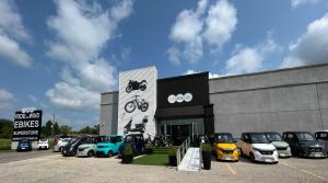 Ride The Wind Ebikes Superstore storefront location with electric bikes, scooters, and small electric vehicles displayed outside the local showroom in Canada.