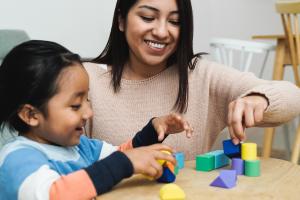 A therapist and child in an ABA session