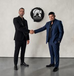 Raphael Ranger and André Rivas shaking hands during a collaboration involving Gang Wayz bulletproof sling bags for the Colombian TV series Envidia La Serie.