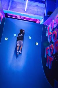 Photo of a kid playing Tag Guerrilla Game in CALI CLUB | Photo provided by TenCL