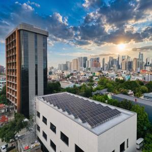 Commercial solar panel installation at Liwayway Marketing Corporation office in the Philippines, designed to help reduce electricity costs and improve energy efficiency.