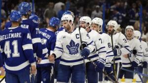 Hockey players doing handshake line
