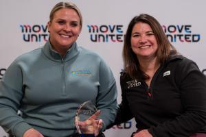 Amie poses with Jessie and the award