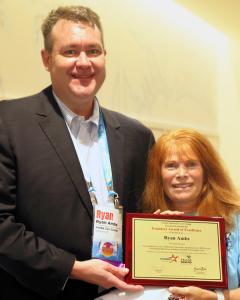 Ryan Ambs CFO of Ambs Call Center Receiving the Founders Award of Excellence at SNUG 2026