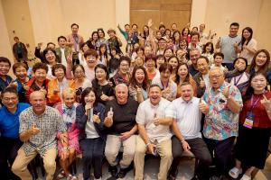 Group of smiling people celebrating