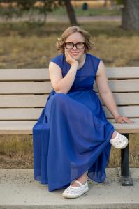 Picture of young woman in blue dress