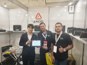 ANCEL staff communicating with global visitors at AUTOPAR 2026 Curitiba Brazil exhibition