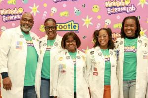 Ava and Her Family posing at The PBS Kids Rootle Mini Fab Science Lab Purple Carpet Event (left to right) Terrence Simmons (Father), Tita Simmons (Mother), Mary L. Foy (late Grandmother), and Chynah Jeter (Sister)