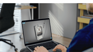 Person using a laptop to view an interactive 3D temperature gauge model on the saVRee learning platform.