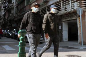 People walking wearing face masks