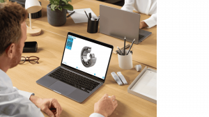 Man at an office desk viewing an interactive 3D cutaway model of a ball bearing on his laptop using the saVRee learning platform.