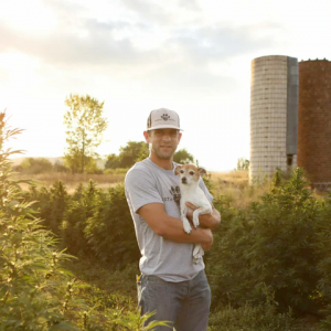Founder sean holding calm dog