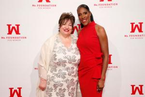 Patricia (Patti) Russo, Executive Director of The Campaign School at Yale, stands beside Ms. Foundation for Women President & CEO Teresa C. Younger at the foundation’s Women of Vision Awards. Russo, wearing a cream dress with silver floral detailing and a