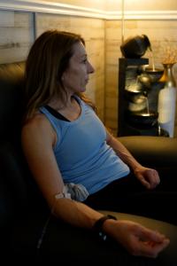 Patient receiving IV therapy in the MetaLounge recovery area at Confidia in Bristol, Connecticut.