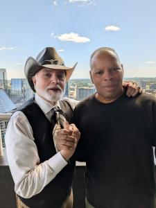 (L-R) Howard Wiggins and Movie Reviews and More host Brian Sebastian in Nashville on the day of the billboard reveal Photo Credit: ©MovieReviewsAndMore