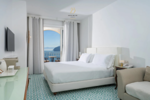 Luxury sea‑view suite with private balcony. Designed to frame the Sorrento coast, where every sunrise feels like a masterpiece.