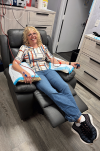 Patient undergoing EBOO therapy while seated comfortably at Confidia Health Institute.