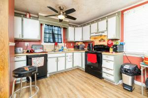 3,440± sf. and features a kitchen, living room, dining room, main floor primary suite w/dual closets and attic.  1/4 wrap-around covered porch.  Soaring ceilings; original hardwood floors; wide trim; built-in cabinetry; new roof in 2019 (approx.).