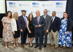 Team members from Lesser, Landy, Smith & Siegel, PLLC pose with Managing Partner Gary Lesser after the firm received the Business of the Year award from the Palm Beach North Chamber of Commerce during the Annual Leadership Awards at PGA National Resort.