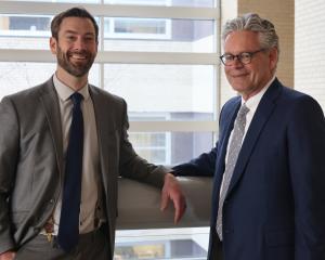 Attorney Evan Tenebruso and Attorney Steve Caya of Nowlan Injury Law standing together.