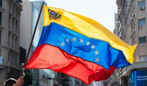 Man holding Venezuelan Flag