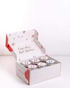 6 flavours in a branded box showing top labels of all 6 flavours. box is open and showing the inside of the lid to the box.