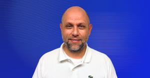 Headshot of Carl "C.J." Unis, newly appointed member of the Crisis Lab Advisory Board, systems engineer with the United States Space Force and principal of Unis Complexity Solutions.
