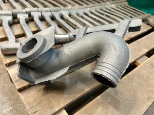 As-cast swan-neck component prior to finishing
