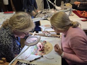 Volunteer stitchers working on the St Paul’s Cathedral panel for the Circle of Life, forming part of the 25-panel circular artwork marking the 400th anniversary of the Worshipful Company of Upholders’ Royal Charter.