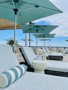 Gulf-front Beach Club at The Club at Mediterra features a clubhouse, pool, outdoor dining and direct access to Bonita Beach.