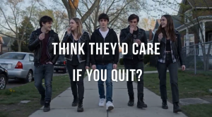 Image of high school kids walking down the street vaping with one kid in the middle not vaping with the text overlay "Think they'd care if you quit"