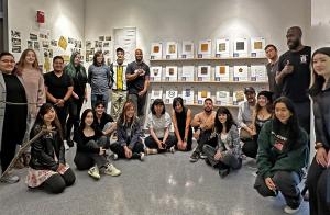 Student Co-Founders of the SFSU Sustainable Materials Library posing in front of materials tiles