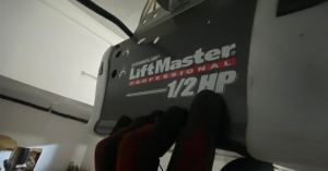 A highly trained professional from Next Hour performing a comprehensive tune-up on a residential garage door system in the SCV.